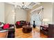 Elegant living room featuring hardwood floors, leather furniture, and a cozy atmosphere at 1731 Panorama Dr, Locust Grove, GA 30248