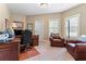 Home office with built-in desk and ample seating at 1731 Panorama Dr, Locust Grove, GA 30248