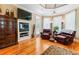 Relaxing sitting area with fireplace and hardwood floors at 1731 Panorama Dr, Locust Grove, GA 30248