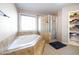 Bathroom with a large garden tub and shower at 540 Flint Ridge Ct, Jonesboro, GA 30238
