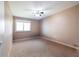 Bright bedroom featuring carpet and a ceiling fan at 540 Flint Ridge Ct, Jonesboro, GA 30238