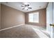 Well-lit bedroom, carpet flooring, ceiling fan at 540 Flint Ridge Ct, Jonesboro, GA 30238
