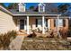 Covered front porch with seating area and brick columns at 540 Flint Ridge Ct, Jonesboro, GA 30238