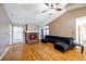 Living room with hardwood floors, fireplace, and sectional sofa at 540 Flint Ridge Ct, Jonesboro, GA 30238