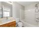 Bright bathroom with a tub and shower combination and updated vanity at 5615 Strathmoor Manor Cir, Lithonia, GA 30058