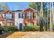 Attractive brick two-story townhome with landscaping at 5615 Strathmoor Manor Cir, Lithonia, GA 30058