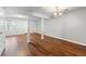 Open concept living room with hardwood floors and ample natural light at 5615 Strathmoor Manor Cir, Lithonia, GA 30058