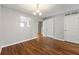 Well-lit dining room with hardwood floors and a modern light fixture at 5615 Strathmoor Mnr, Lithonia, GA 30058