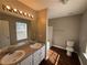 Bathroom with double vanity, a large mirror, and a separate shower and toilet at 6403 Walnut Way, Union City, GA 30291