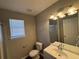 Bathroom with vanity, toilet and shower/tub combo at 6403 Walnut Way, Union City, GA 30291