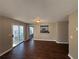 Dining area with dark hardwood floors and sliding glass doors leading to a patio at 6403 Walnut Way, Union City, GA 30291