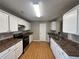 Kitchen with white cabinets, granite countertops, and stainless steel appliances at 6403 Walnut Way, Union City, GA 30291
