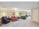 Spacious finished basement with comfortable seating areas and plenty of natural light at 2505 Ridgehurst Dr, Buford, GA 30518