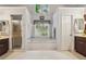 Bathroom features soaking tub, shower, and hexagonal tile floor at 2505 Ridgehurst Dr, Buford, GA 30518
