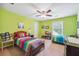 Bedroom with two twin beds and green painted accent wall at 2505 Ridgehurst Dr, Buford, GA 30518