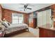 Bedroom with brick accent wall and double-door closet at 2505 Ridgehurst Dr, Buford, GA 30518