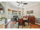Bright dining room features hardwood floors, a round table with four chairs, and built-in hutch at 2505 Ridgehurst Dr, Buford, GA 30518
