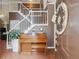 Elegant entryway with staircase, piano, and hardwood floors at 2505 Ridgehurst Dr, Buford, GA 30518