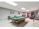 Finished basement game room with a pool table and comfortable seating at 2505 Ridgehurst Dr, Buford, GA 30518