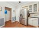 Modern kitchen features stainless steel refrigerator and white cabinets at 2505 Ridgehurst Dr, Buford, GA 30518
