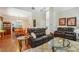 Open living space with hardwood floors, high ceilings, and a view of the dining area at 2505 Ridgehurst Dr, Buford, GA 30518