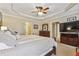 Main bedroom with king-size bed, large TV, and ample closet space at 2505 Ridgehurst Dr, Buford, GA 30518