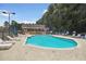 Community pool with lounge chairs and clubhouse at 2505 Ridgehurst Dr, Buford, GA 30518