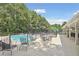 Community pool with patio furniture and seating area at 2505 Ridgehurst Dr, Buford, GA 30518