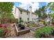 A sprawling backyard with lush greenery, a shed, and raised garden beds at 42 Millstone Gln, Dallas, GA 30157