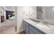 Bright bathroom featuring a double sink vanity with granite countertop and walk-in shower at 42 Millstone Gln, Dallas, GA 30157