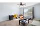 Bright bedroom with neutral tones, a ceiling fan, and a cozy sitting area at 42 Millstone Gln, Dallas, GA 30157