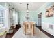 Inviting dining room with natural wood floors and a modern light fixture at 42 Millstone Gln, Dallas, GA 30157