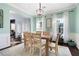 Inviting dining room with a light color scheme and natural wood floors at 42 Millstone Gln, Dallas, GA 30157