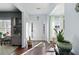 Bright foyer with hardwood floors, white trim, and decorative plants at 42 Millstone Gln, Dallas, GA 30157
