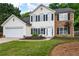 Beautiful two-story home with stone accents, a well-maintained lawn, and an attached garage at 42 Millstone Gln, Dallas, GA 30157