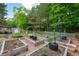 A backyard with a shed in the background and a garden with plots of flowers, herbs and vegetables at 42 Millstone Gln, Dallas, GA 30157