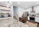 Spacious kitchen with granite countertops, stainless steel appliances, and a functional island at 42 Millstone Gln, Dallas, GA 30157