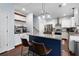 Bright kitchen features a granite island, stainless appliances, and white cabinetry at 42 Millstone Gln, Dallas, GA 30157