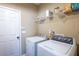 Laundry room featuring a side-by-side washer and dryer at 42 Millstone Gln, Dallas, GA 30157