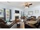 Bright living room features a fireplace, cozy seating, and plenty of natural light at 42 Millstone Gln, Dallas, GA 30157
