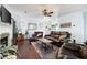 Spacious living room with comfortable seating, fireplace, and bright natural light at 42 Millstone Gln, Dallas, GA 30157