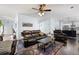 Bright living room flows into modern kitchen, with dark wood floors and neutral tones at 42 Millstone Gln, Dallas, GA 30157