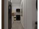 Modern galley kitchen with black appliances and white cabinets at 6305 Shannon Pkwy # 202, Union City, GA 30291