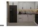 Modern kitchen with black appliances and white cabinets at 6305 Shannon Pkwy # 202, Union City, GA 30291