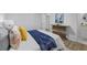 Well-lit bedroom features hard wood floors, a decorative table, and en-suite bathroom at 132 Arnold Pl, Jonesboro, GA 30236