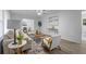 Stylish living room with contemporary furnishings, wood floors, and abundant natural light at 132 Arnold Pl, Jonesboro, GA 30236