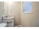 Small bathroom with granite countertop, toilet and window at 2848 Baker Ridge Nw Dr, Atlanta, GA 30318