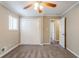 Bright bedroom featuring carpet, double-door closet, and ceiling fan at 2848 Baker Ridge Nw Dr, Atlanta, GA 30318