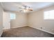 Spacious bedroom with neutral walls, ceiling fan, and carpet flooring at 2848 Baker Ridge Nw Dr, Atlanta, GA 30318