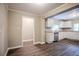 Bright dining area with wood-look flooring and kitchen access at 2848 Baker Ridge Nw Dr, Atlanta, GA 30318